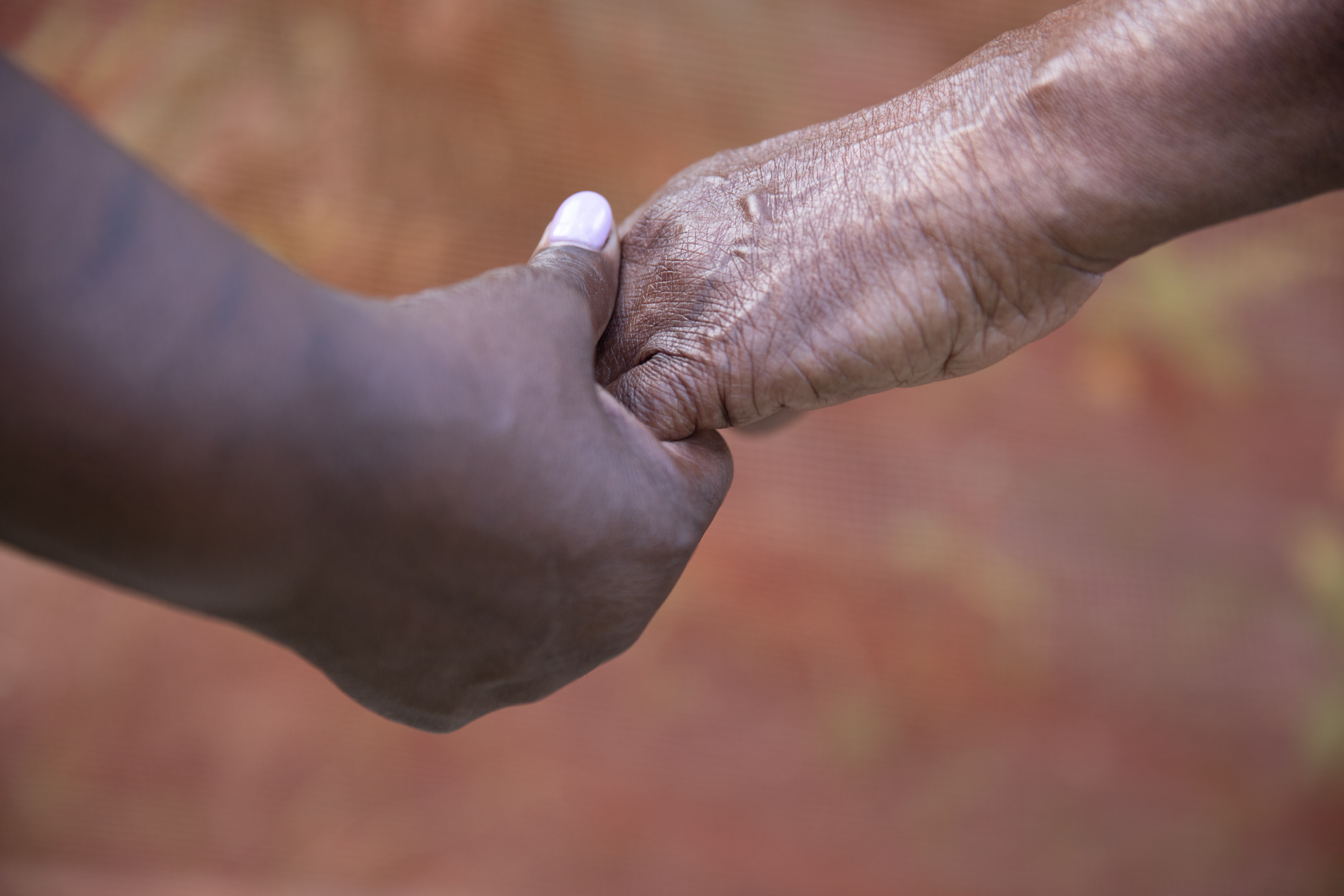 Two holding hands